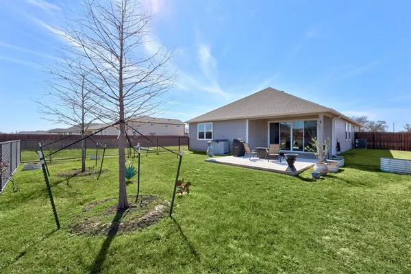 a front view of a house with swimming pool and porch