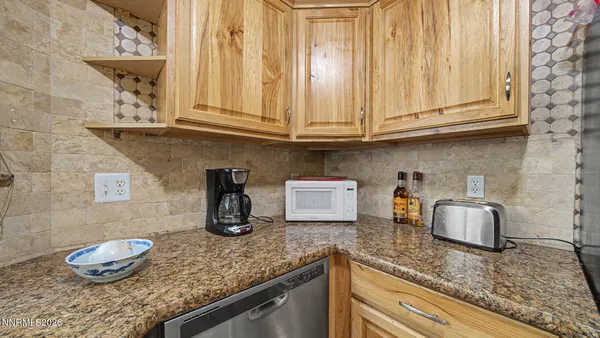 a kitchen with granite countertop cabinets and sink