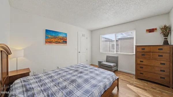 a bedroom with a bed and furniture