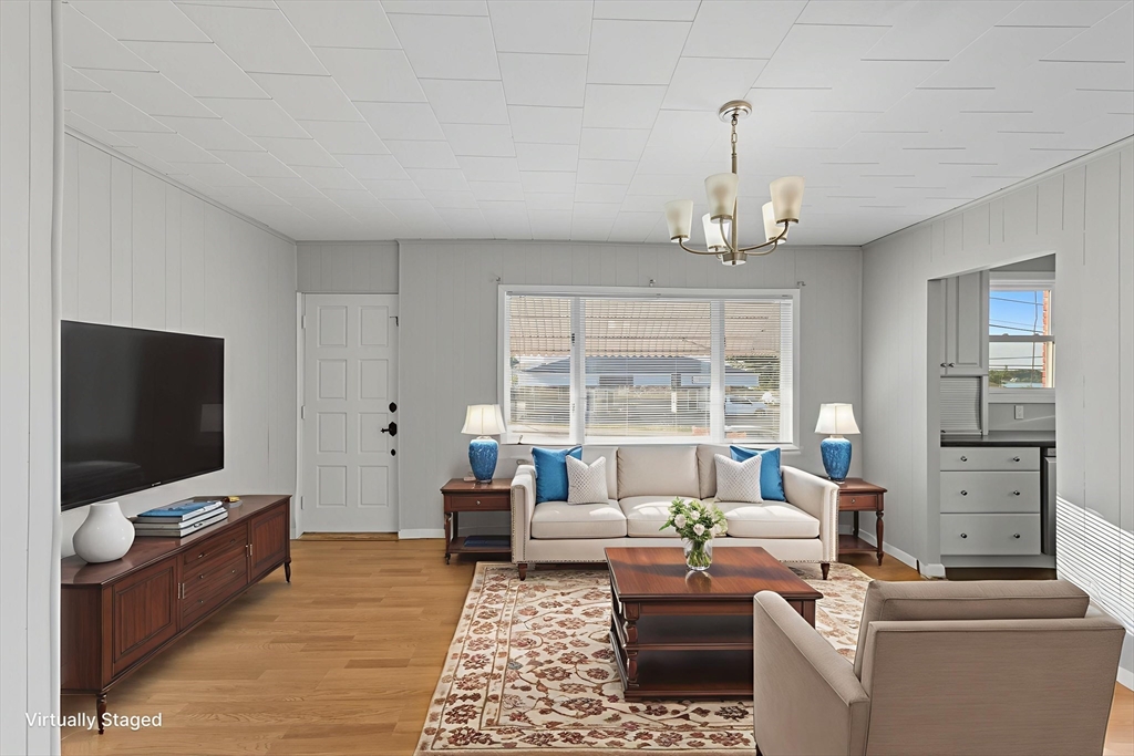 130 Broadway Fall River, MA 02721 - Photo 3 of 42 a living room with furniture and a flat screen tv