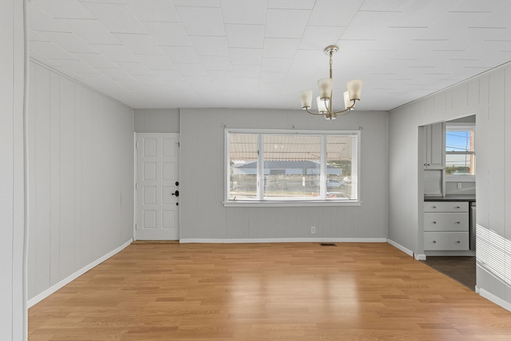 130 Broadway Fall River, MA 02721 - Photo 4 of 42 a view of an empty room with window and cabinet