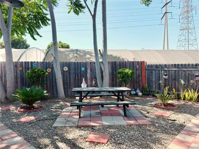 a view of a chairs and table in the patio
