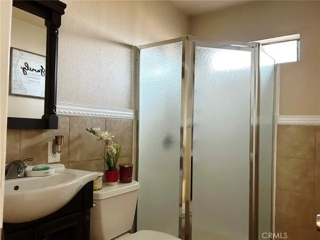 a bathroom with a sink toilet and vanity