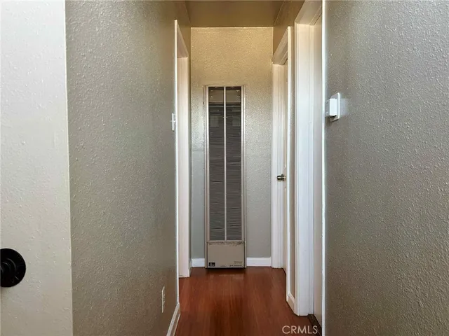 a view of a small space with wooden floor