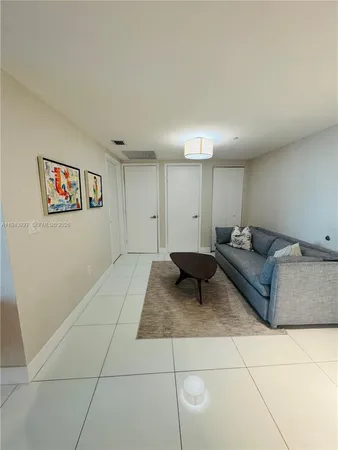 a living room with furniture and a rug