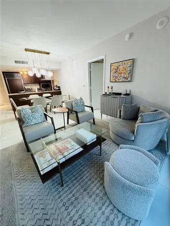 a living room with furniture and a rug