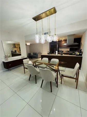a kitchen with a table chairs and a stove
