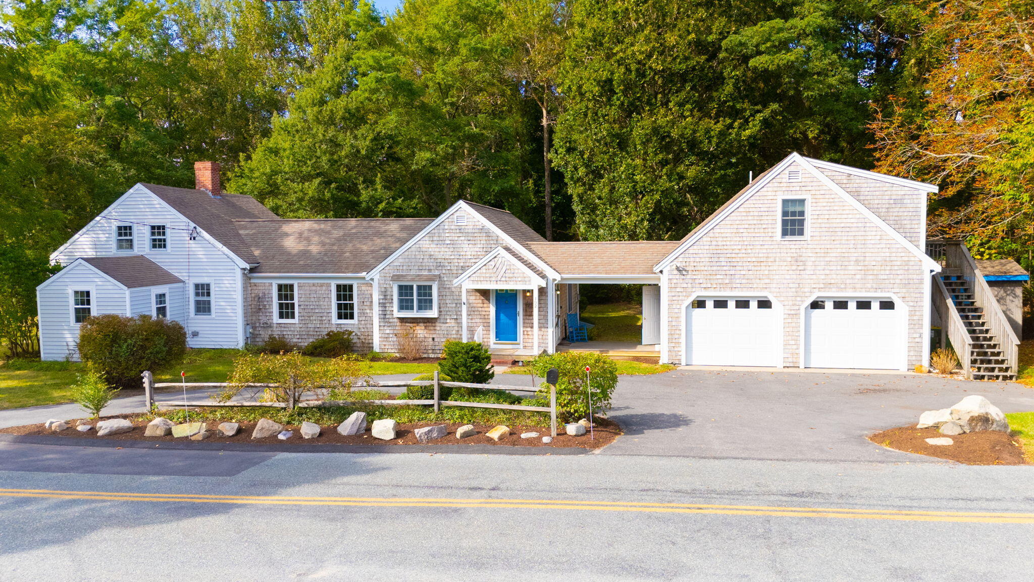 102 Portanimicut Road Orleans, MA 02653 - Photo 2 of 36 a front view of a house with garden