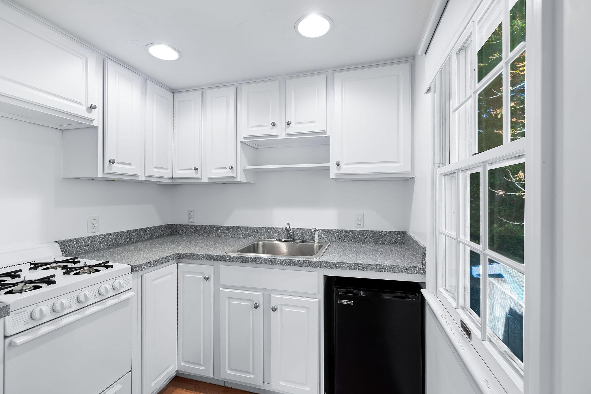 102 Portanimicut Road Orleans, MA 02653 - Photo 25 of 36 a kitchen with stainless steel appliances granite countertop a sink and a stove