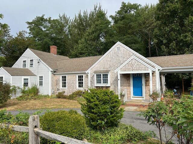 102 Portanimicut Road Orleans, MA 02653 - Photo 4 of 36 a front view of a house with a yard