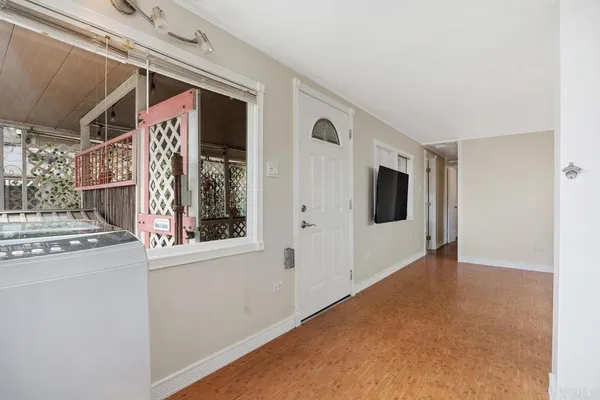 a view of an empty room with a window