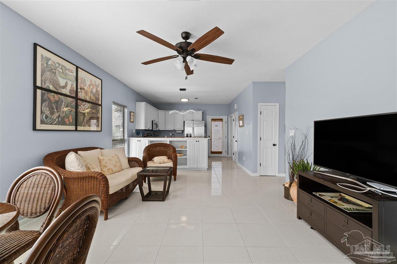 16590 Perdido Key Drive, Unit 6B Pensacola, FL 32507 - Photo 19 of 25 a living room with furniture and a flat screen tv