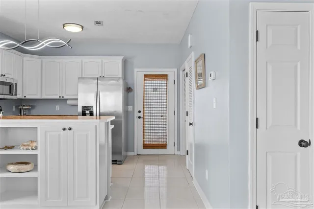 a bathroom with a granite countertop sink a toilet and a shower