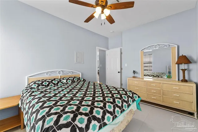 a bedroom with a bed and a dresser