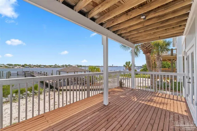 a view of a balcony with wooden floor