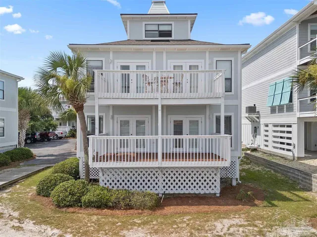 a front view of a house with a fence