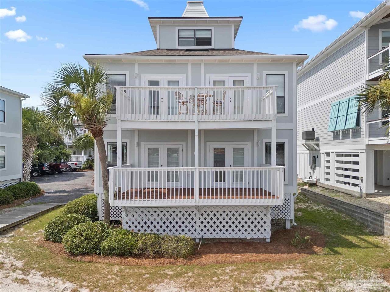 16590 Perdido Key Drive, Unit 6B Pensacola, FL 32507 - Photo 24 of 25 a front view of a house with a fence
