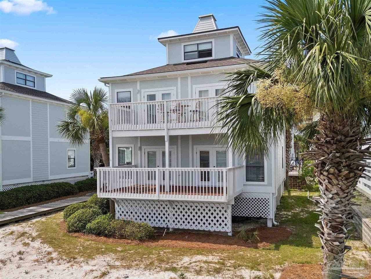 16590 Perdido Key Drive, Unit 6B Pensacola, FL 32507 - Photo 25 of 25 a front view of a house with a garden