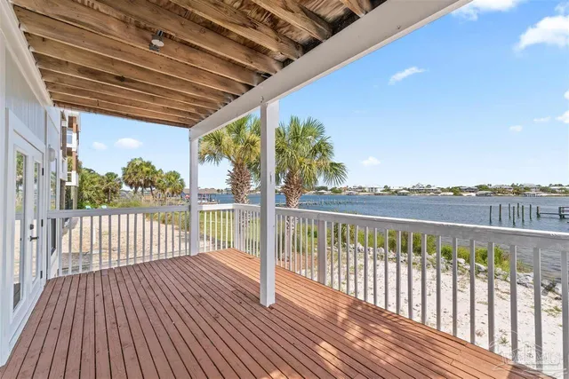 a view of a balcony with wooden floor