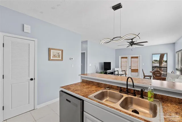 a kitchen with a sink and a refrigerator