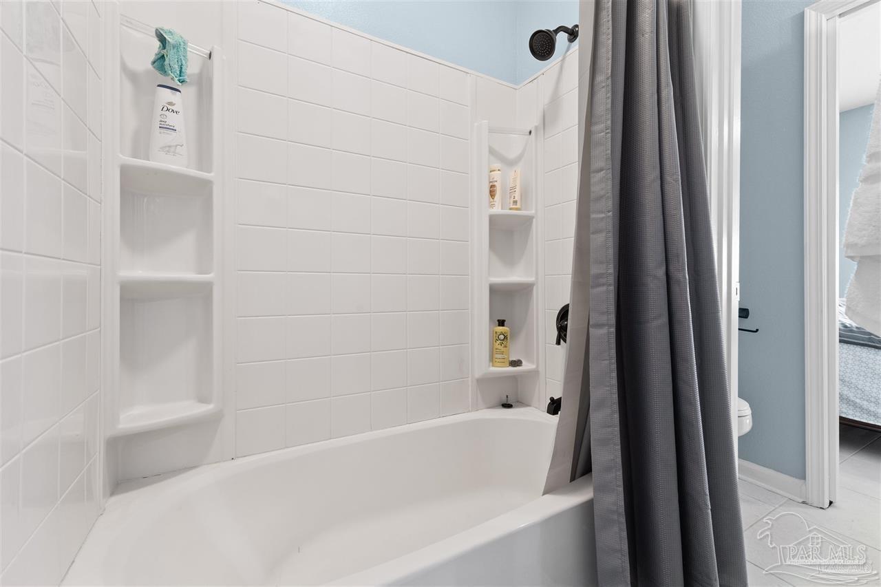 16590 Perdido Key Drive, Unit 6B Pensacola, FL 32507 - Photo 10 of 25 a bathroom with a bathtub