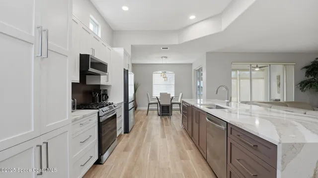 a large kitchen with cabinets