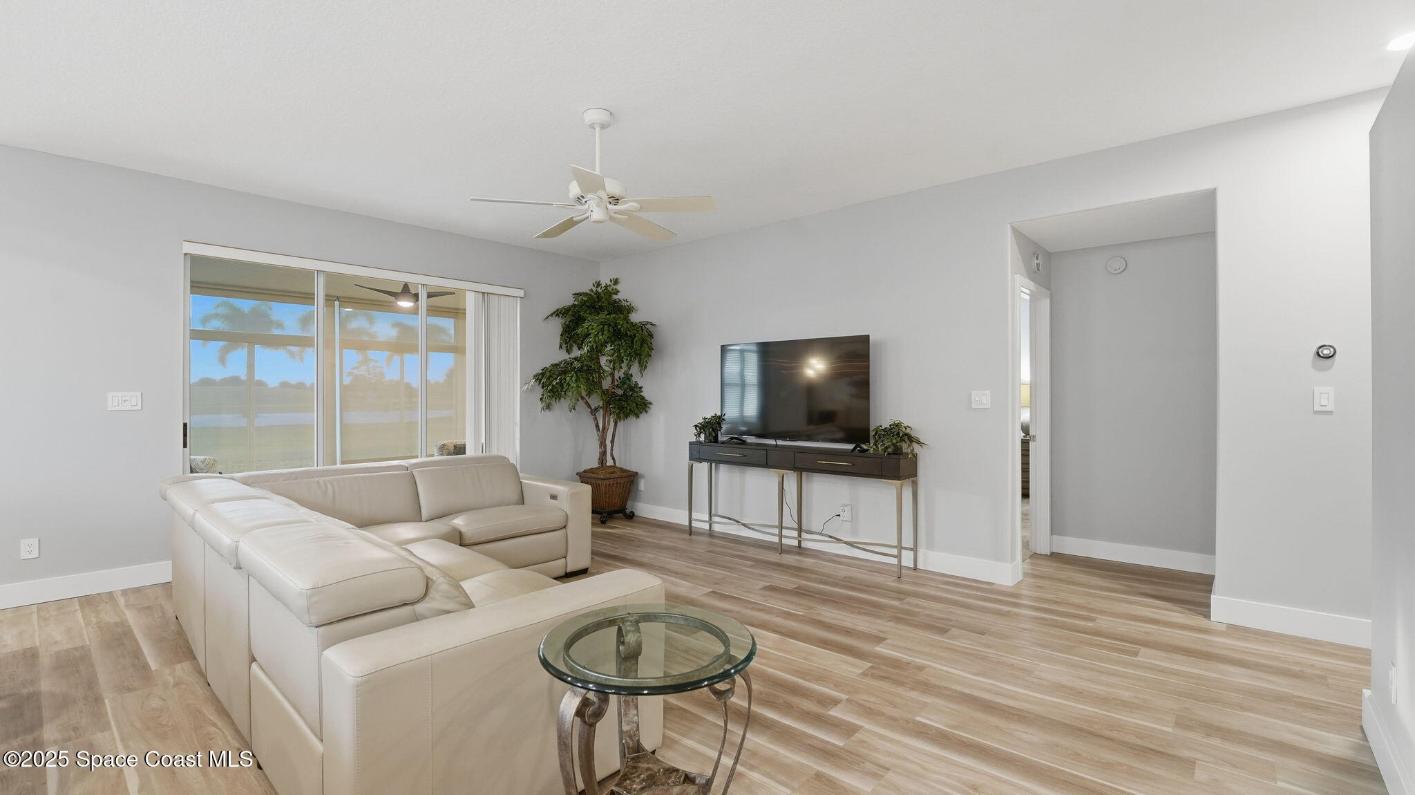 4810 Bren Court Rockledge, FL 32955 - Photo 14 of 43 a living room with furniture and a flat screen tv