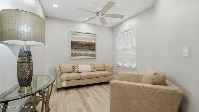 a living room with furniture and a window