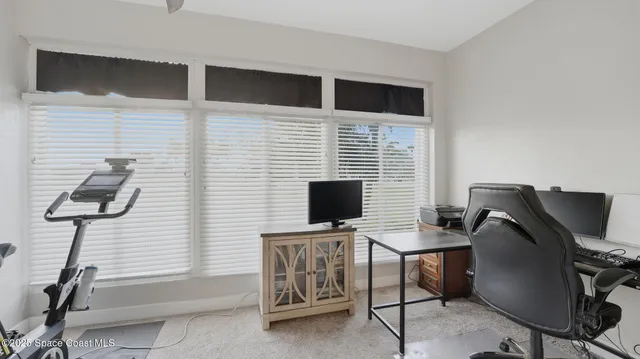 a workspace with furniture and a projector