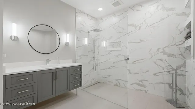 a bathroom with a double vanity sink and a mirror