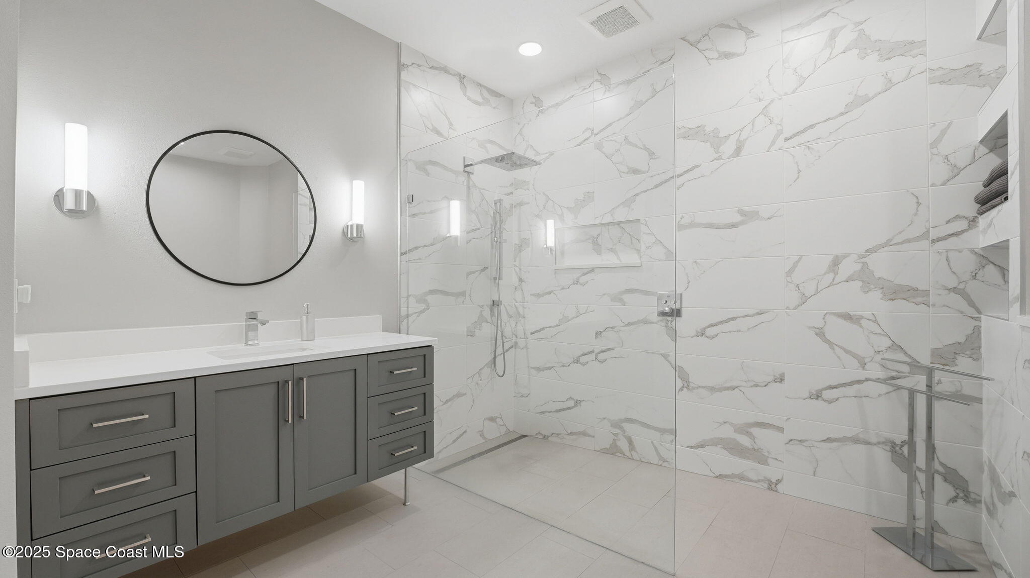 4810 Bren Court Rockledge, FL 32955 - Photo 22 of 43 a bathroom with a double vanity sink and a mirror