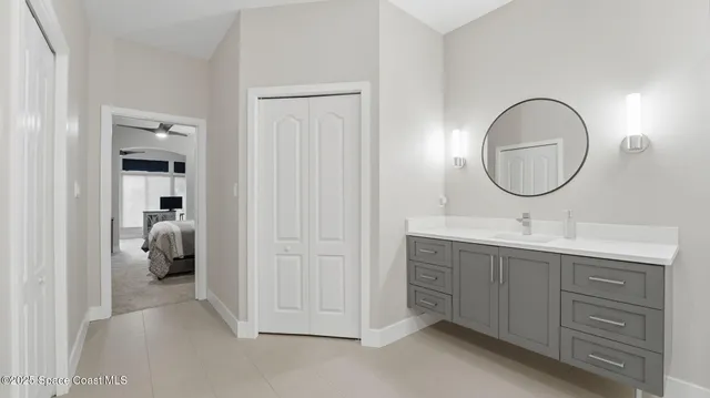 a bathroom with a double vanity sink and a mirror