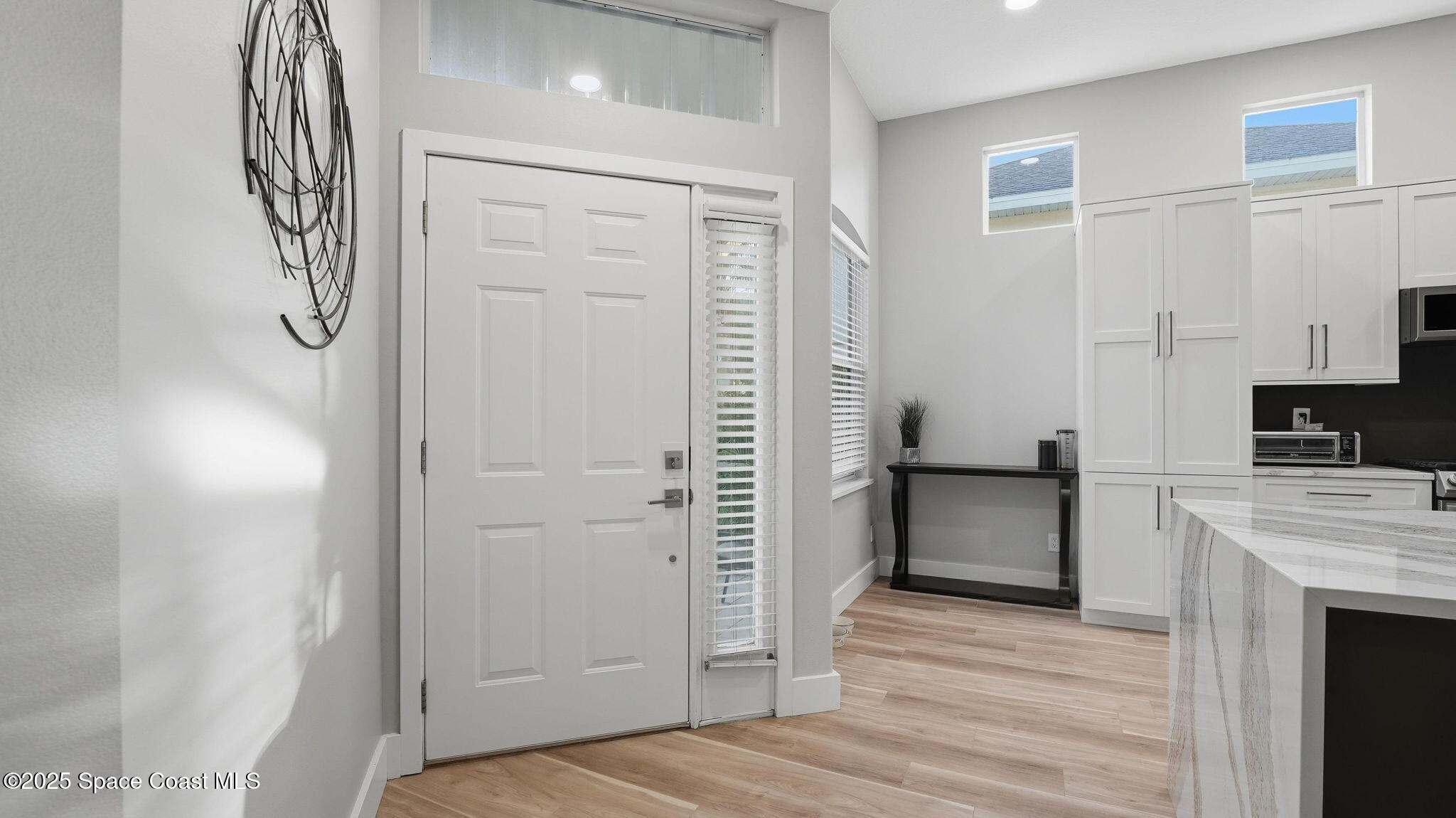 4810 Bren Court Rockledge, FL 32955 - Photo 6 of 43 a view of a kitchen from the hallway