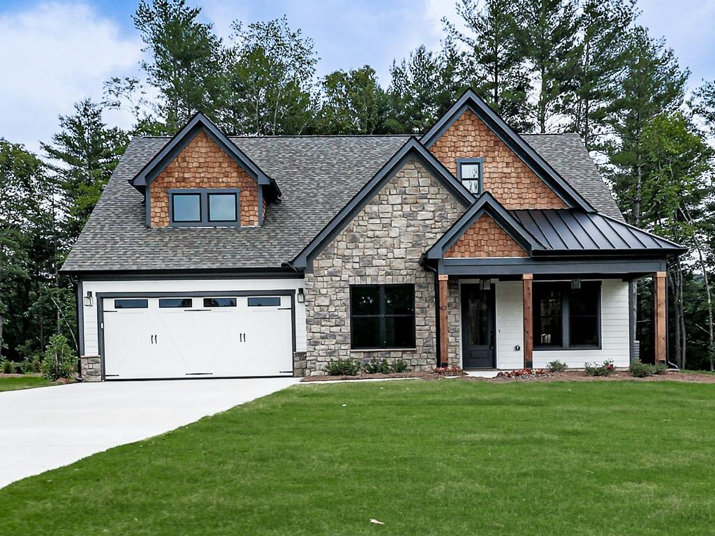 63 Rdg Crk Lane Ellijay, GA 30540 - Photo 1 of 1 a front view of a house with a yard and garage