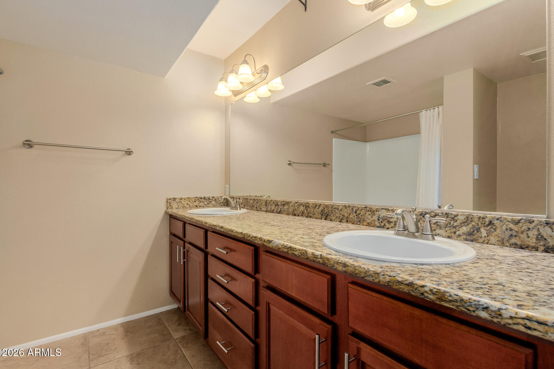 885 North Granite Reef Road, Unit 82 Scottsdale, AZ 85257 - Photo 16 of 32 a bathroom with a granite countertop sink and a mirror