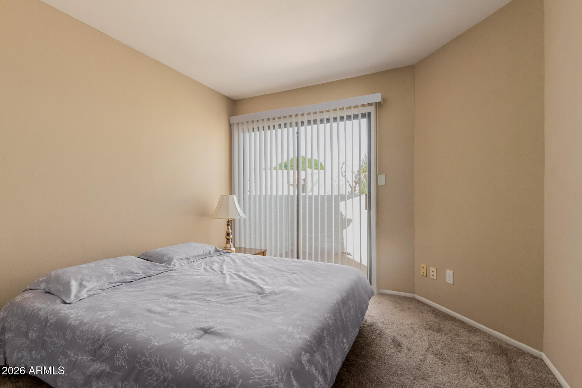 885 North Granite Reef Road, Unit 82 Scottsdale, AZ 85257 - Photo 18 of 32 a bedroom with a bed and a window