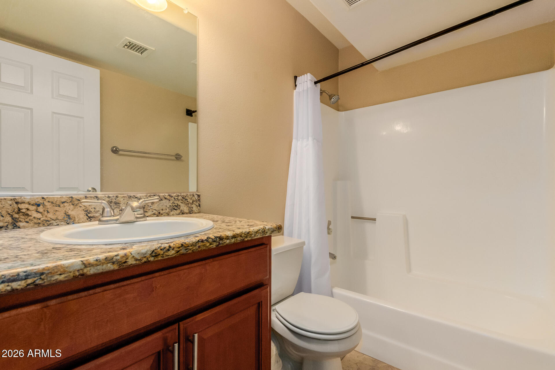 885 North Granite Reef Road, Unit 82 Scottsdale, AZ 85257 - Photo 20 of 32 a bathroom with a granite countertop sink toilet and shower