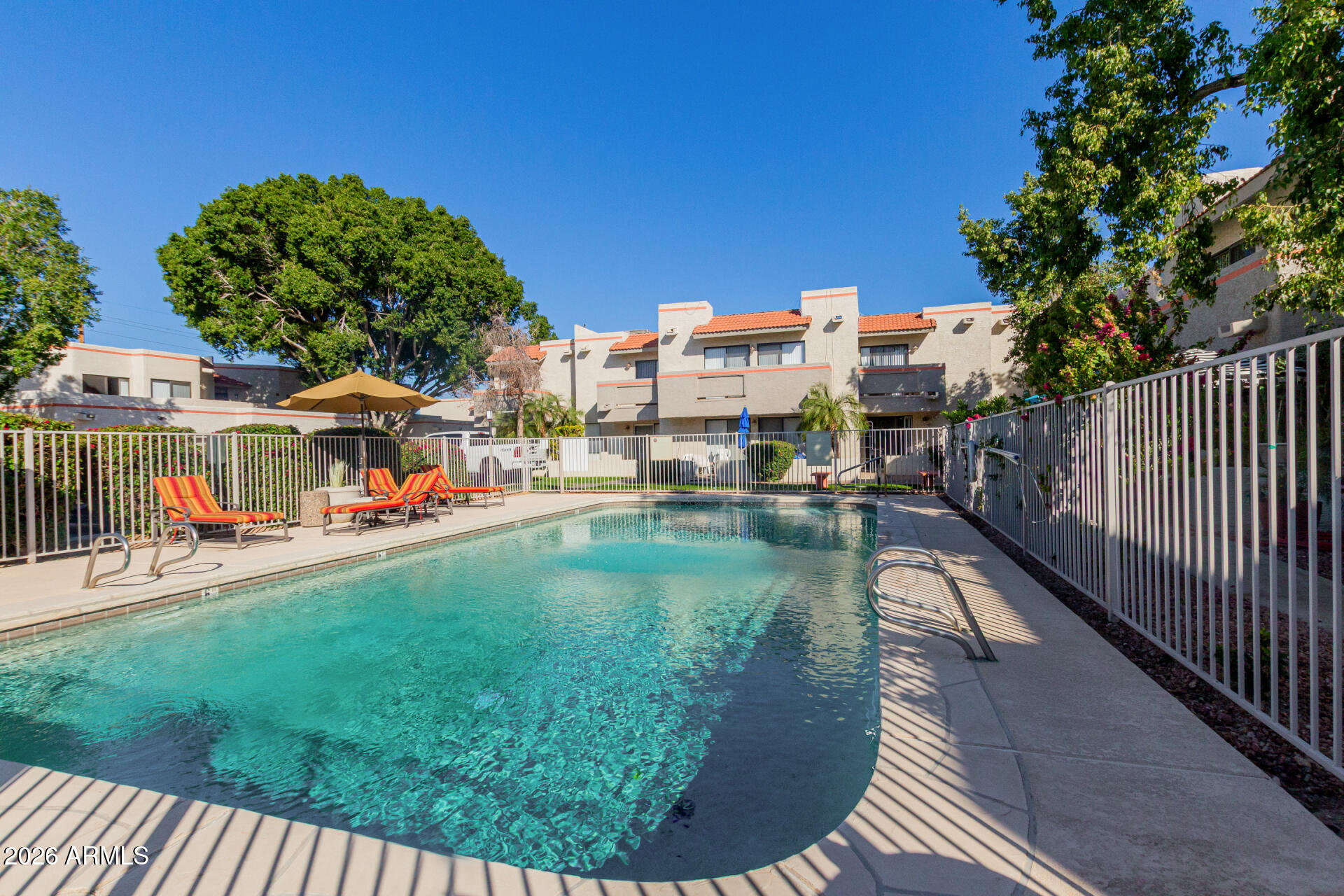 885 North Granite Reef Road, Unit 82 Scottsdale, AZ 85257 - Photo 23 of 32 a view of a swimming pool from a balcony