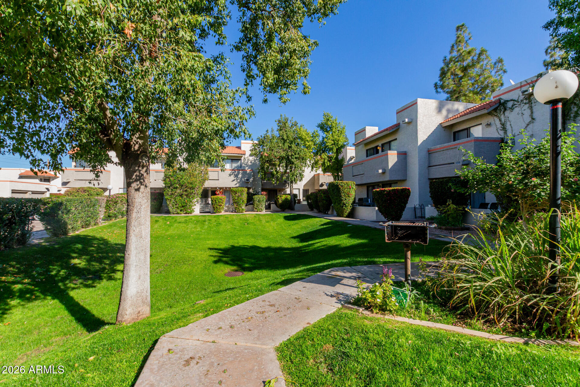 885 North Granite Reef Road, Unit 82 Scottsdale, AZ 85257 - Photo 30 of 32 a view of a garden with a building in the background