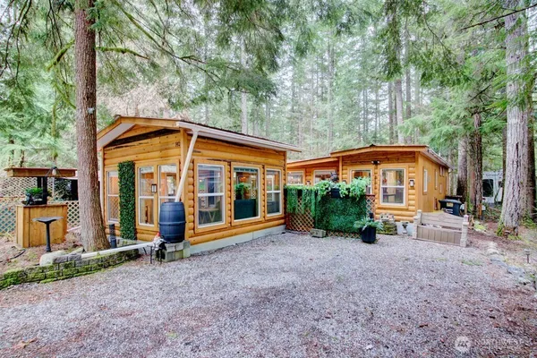 a view of a house with backyard and porch