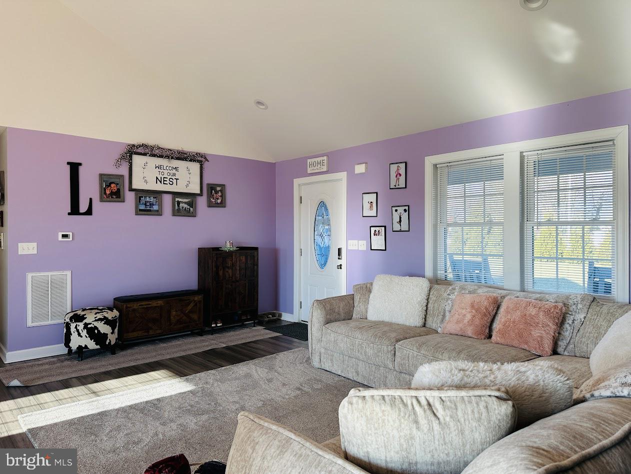7082 Cannon Road Bridgeville, DE 19933 - Photo 13 of 67 a living room with furniture and a flat screen tv
