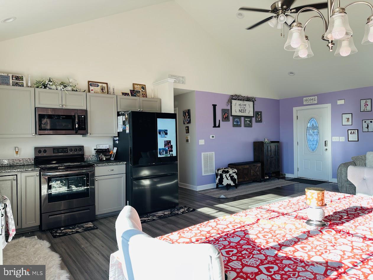 7082 Cannon Road Bridgeville, DE 19933 - Photo 15 of 67 a room with furniture a flat screen tv and a fireplace