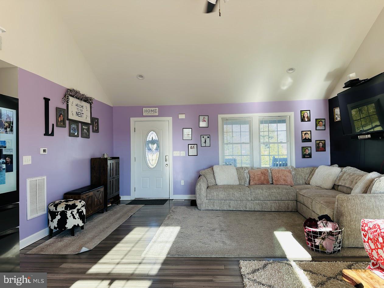 7082 Cannon Road Bridgeville, DE 19933 - Photo 16 of 67 a living room with furniture and a flat screen tv