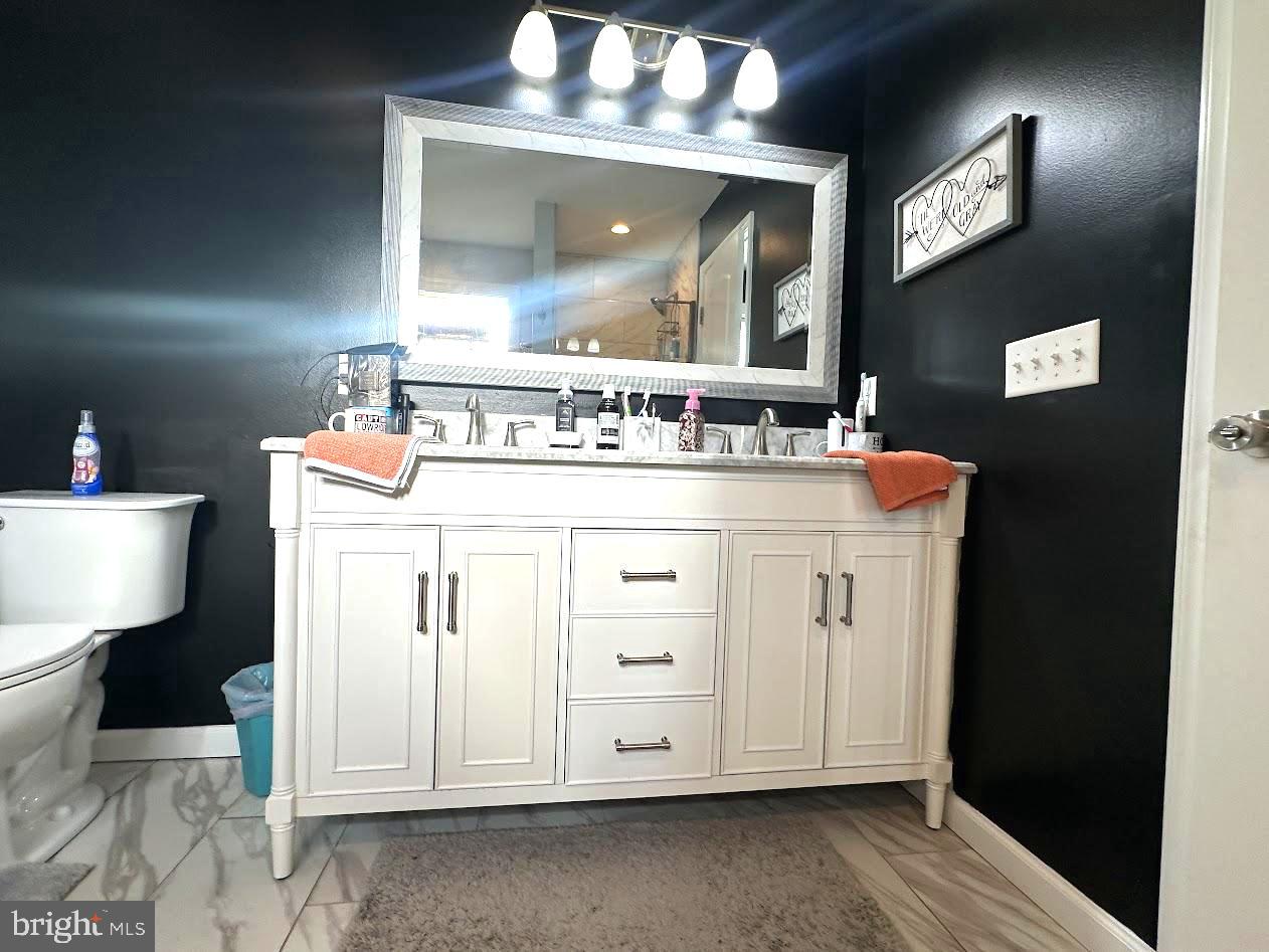 7082 Cannon Road Bridgeville, DE 19933 - Photo 25 of 67 a bathroom with a sink vanity and mirror
