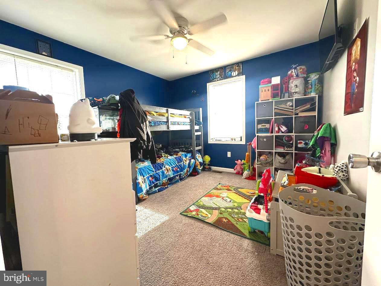 7082 Cannon Road Bridgeville, DE 19933 - Photo 35 of 67 a bedroom with furniture a chandelier fan and a window