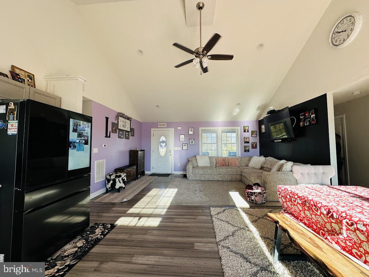 7082 Cannon Road Bridgeville, DE 19933 - Photo 10 of 67 a living room with furniture and a flat screen tv