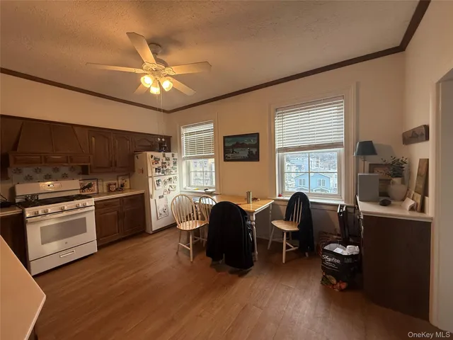 a kitchen with stainless steel appliances granite countertop a stove and a refrigerator