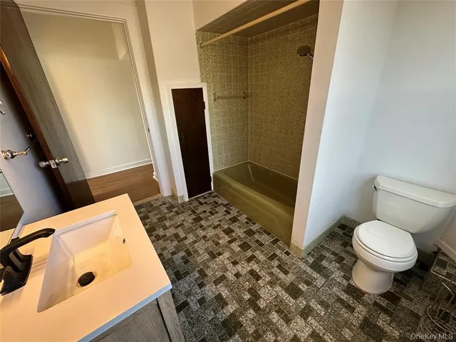 a bathroom with a sink and a toilet