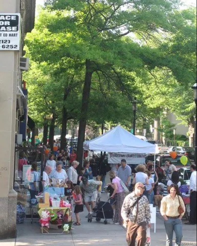 a view of a patio with table and chairs under an umbrella