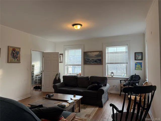 a living room with furniture and windows